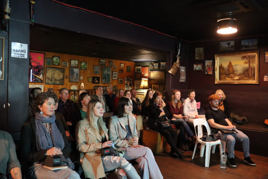 A diverse group of community members attending an eco-conscious event hosted by Christchurch Envirohub.