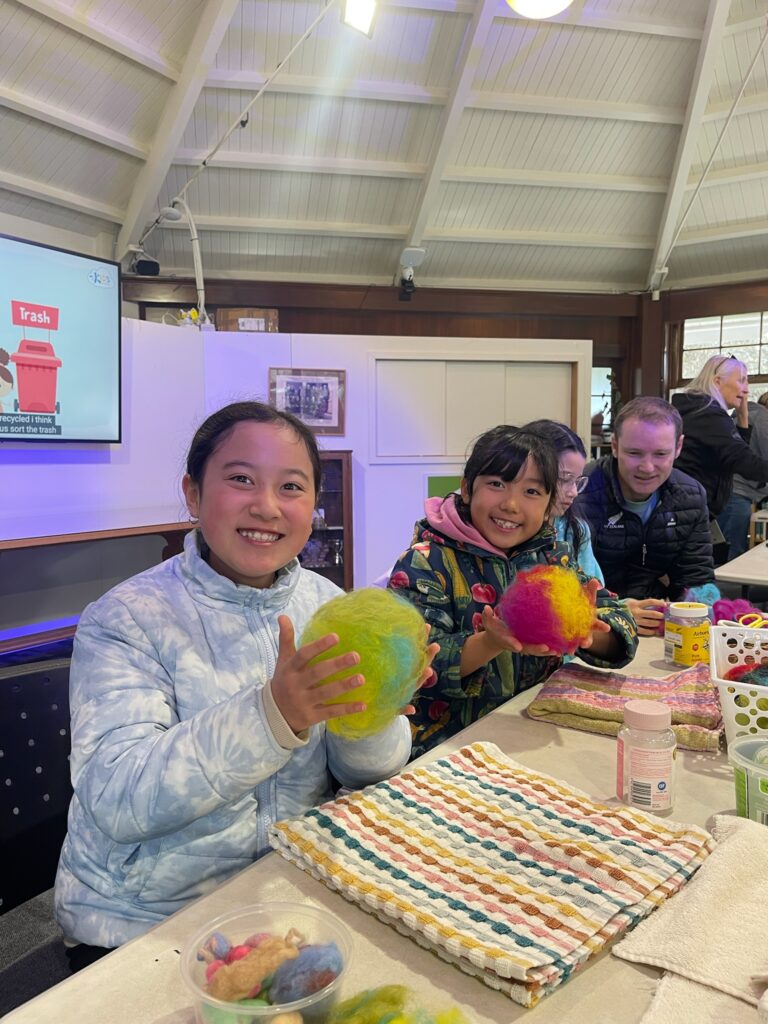 Envirokids participant smiling during a creative indoor workshop in Christchurch.